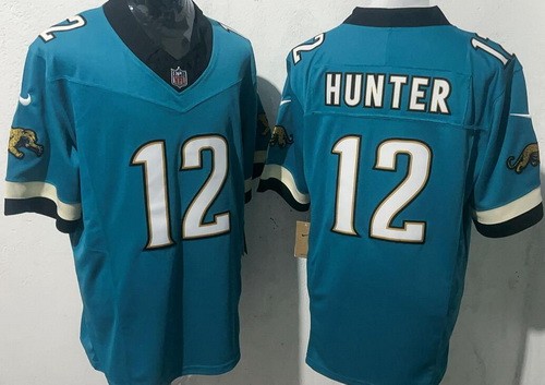 Men's Jacksonville Jaguars #12 Travis Hunter Limited Green Throwback FUSE Vapor Jersey